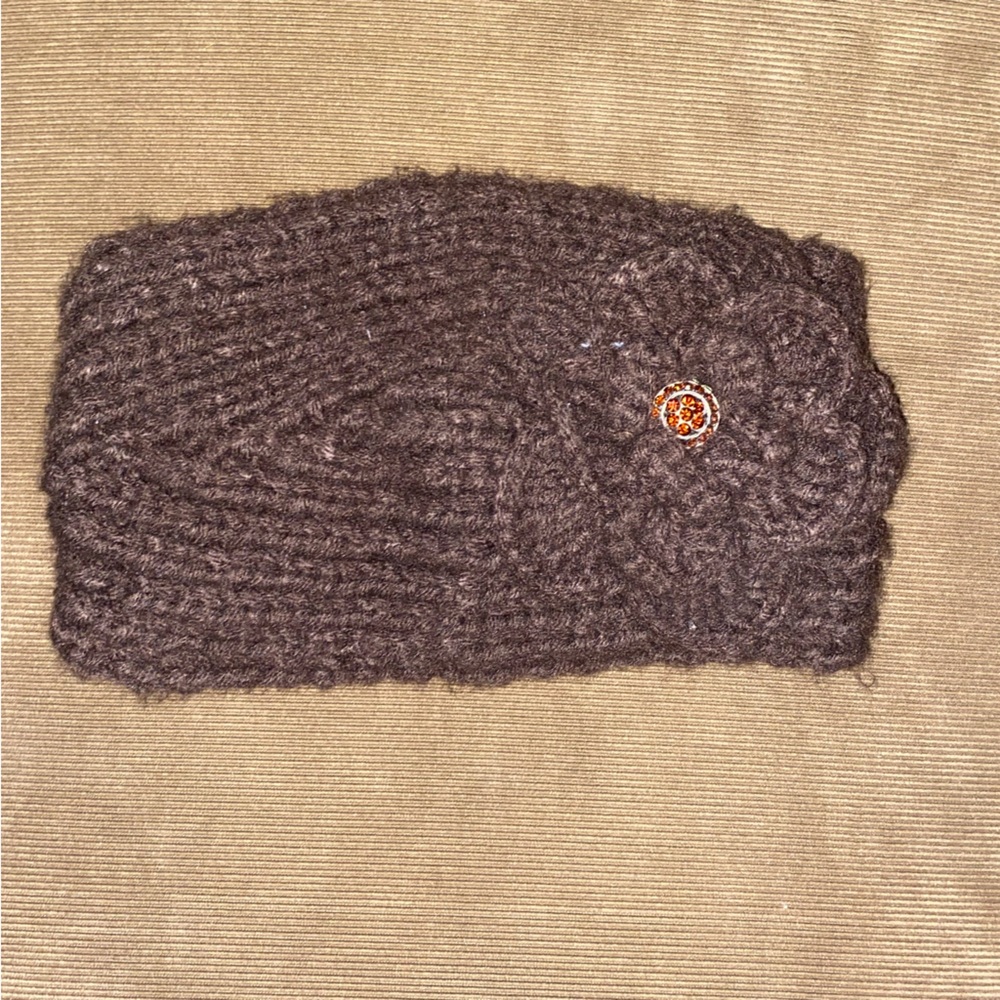 Brown knit winter headband with flower detail